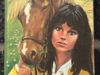 Lotte lærer at ride